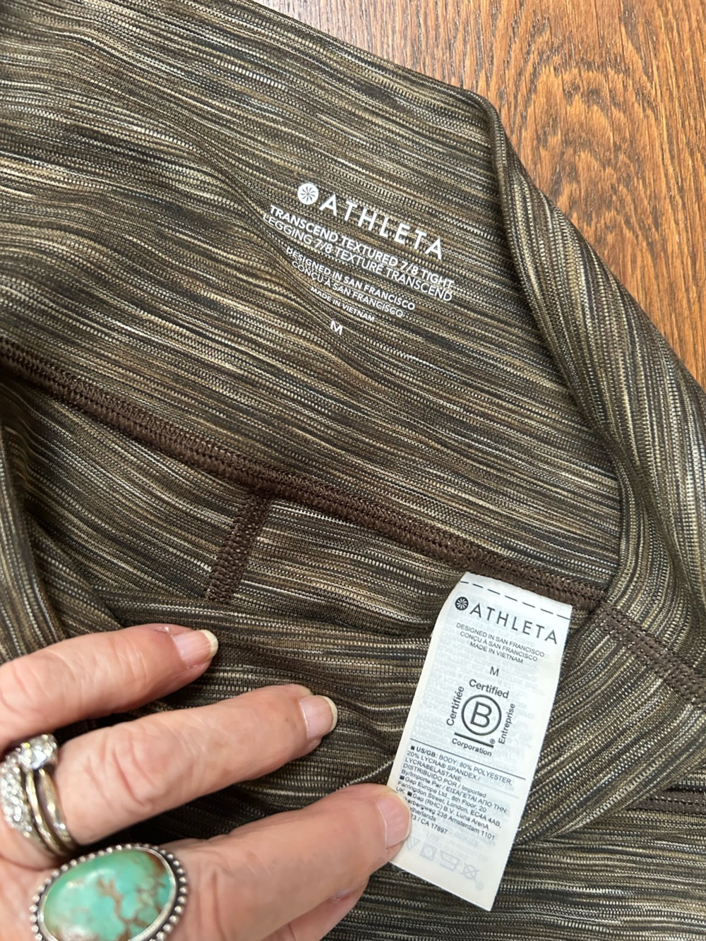 Athleta Transcend Textured 7/8 tight leggings. Olive & Beige Stripe Performance